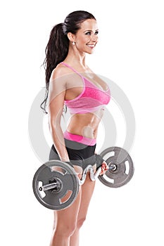 Nice woman doing workout with big dumbbell, retouched
