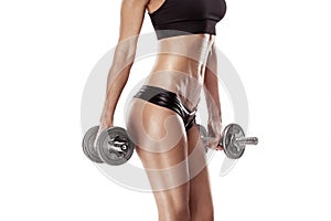 Nice woman doing workout with dumbbell