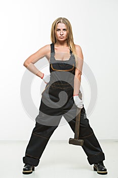 Nice woman mechanic holding wrench isolated over white background