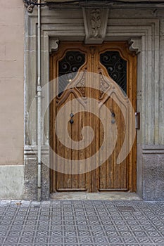 Nice wooden door in one of the streets of Barcelona