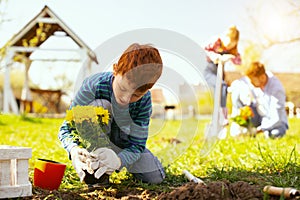 Nice young boy working outdoors