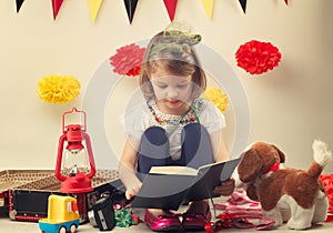 Nice young girl reading a book