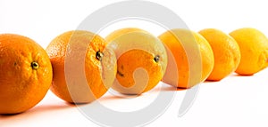 Nicely colored oranges on a white background - front and back lined next to each other