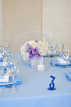 Nicely decorated wedding table with flowers