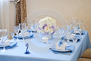 Nicely decorated wedding table with flowers