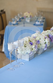 Nicely decorated wedding table with flowers