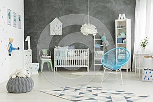 Nicely furnished baby boys room photo