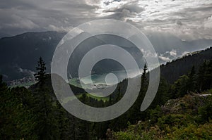 Nicely illuminated Achen lake with dramatic cloudy sky, The Brandenberg Alps, Austria, Europe photo