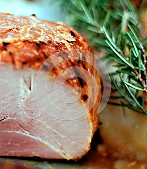 Nicely presented roast ham with rosemary