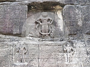 Niche in rock face with image of Narasimha, Lion avatar of Vishnu, guarded by two dvarpalas guardians, Udayagiri Caves, India