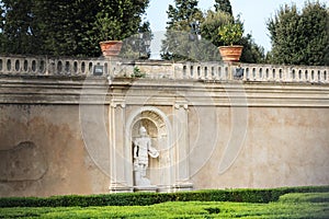 Niche with a sculpture of a Roman soldier in the wall on villa Doria Pamphili