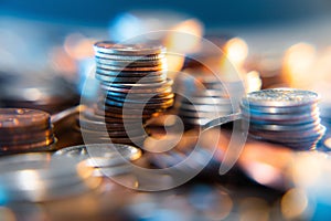 Nickels dimes and quarters with a shallow depth of field and selective focus about to collapse