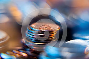 Nickels dimes and quarters with a shallow depth of field and selective focus about to collapse