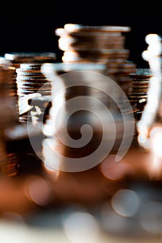 Nickels dimes and quarters with a shallow depth of field and selective focus about to collapse