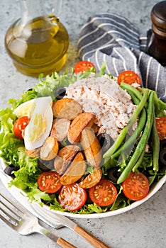 Nicoise salad with tuna, beans, vegetables and potatoes