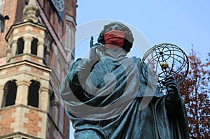 Nicolaus Copernicus with mask and globe