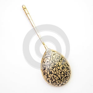 Niello silver spoon on white background