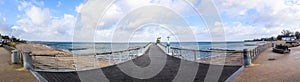 Niendorf, Germany - 30.January 2022: View of the stormy Baltic Sea at a pier in Niendorf on Timmendorfer Strand photo