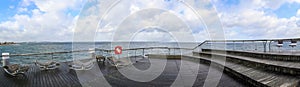 Niendorf, Germany - 30.January 2022: View of the stormy Baltic Sea at a pier in Niendorf on Timmendorfer Strand photo