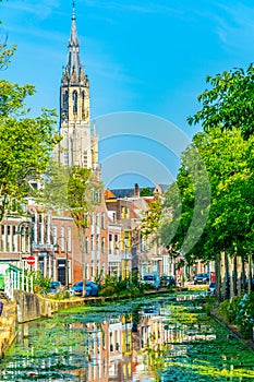 Nieuwe Kerk church viewed behind a channel in Delft, Netherlands