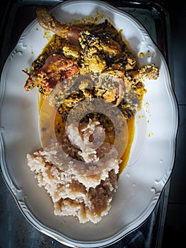 Nigeria stable food : Garri with egusi soup photo