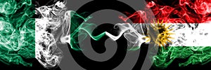 Nigeria vs Kurdistan, Kurdish abstract smoky mystic flags placed side by side. Thick colored silky smoke flags of Nigerian and