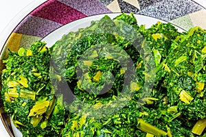Nigeria, Yoruba cuisine; Close up a bowl of efo, or green leafy vegetables