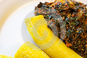 Nigerian Boiled Plantain served with a spicy vegetable sauce