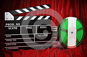 Nigerian cinematography, film industry, cinema in Nigeria. Clapperboard with and film reels on the red fabric, 3D rendering