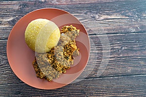 Nigerian Egusi Melon soup with garri eba for lunch