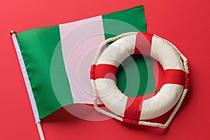 Nigerian flag and lifeline on an abstract background, concept on the theme of helping Nigeria