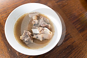 Nigerian Goat Meat Pepper soup served in a white bowl