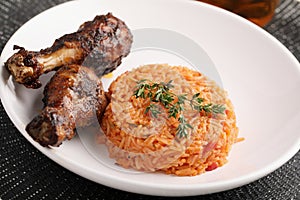Nigerian Jollof Rice with chicken thigh photo