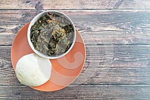 Nigerian Pounded Yam Served with Afang Soup ready to eat photo