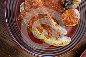 Nigerian Roasted Plantains - Boli with spicy pepper sauce photo