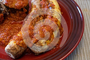 Nigerian Roasted Plantains - Boli with spicy pepper sauce photo