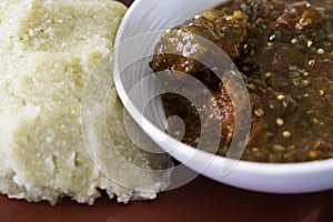 Nigerian Spicy Okro and Pepper stew served with Eba ready to eat photo