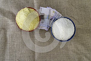 Nigerian yellow and white Garri in Bowls at marketplace photo