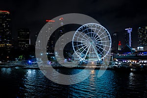 Night aerial panorama Miami Skyviews ferris wheel at Bayside Marketplace reflection in water photo