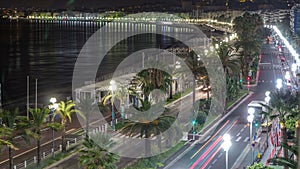 Night aerial panorama of Nice timelapse, France. Lighted Old Town little streets and waterfront