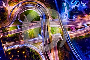 Night Aerial view of a freeway intersection traffic trails in night Moscow