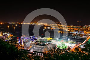 night aerial view of illuminated gibraltar, its airport, la linea de la concepcion town in spain and algeciras bay
