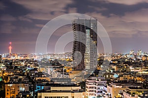 Night aerial view of Tel Aviv City with modern skylines and luxury hotels at the beach near the Tel Aviv port in Israel