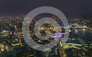 Night aerial view of Tower Bridge and City of London, England