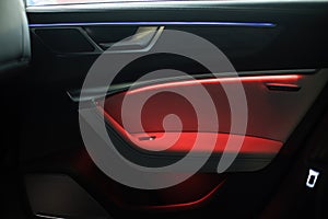 Night ambient led light inside of car interior. door card