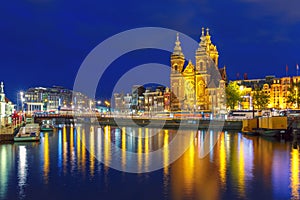 Night Amsterdam canal and Basilica Saint Nichola