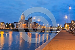 Night Amsterdam canal and Basilica Saint Nicholas