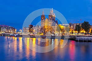 Night Amsterdam canal and Basilica Saint Nicholas