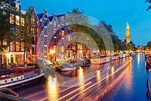 Night Amsterdam canal and Westerkerk church photo