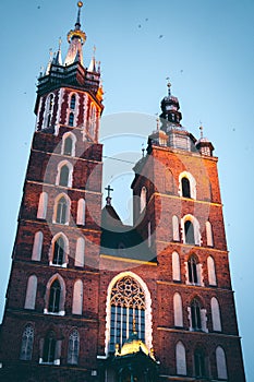 Night Architecture. travel and tourism concept, Poland Bazylika Mariacka. Krakow, Poland. vertical photo photo